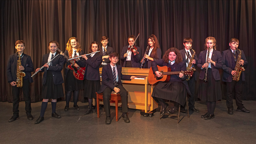 Students posed with musical instruments